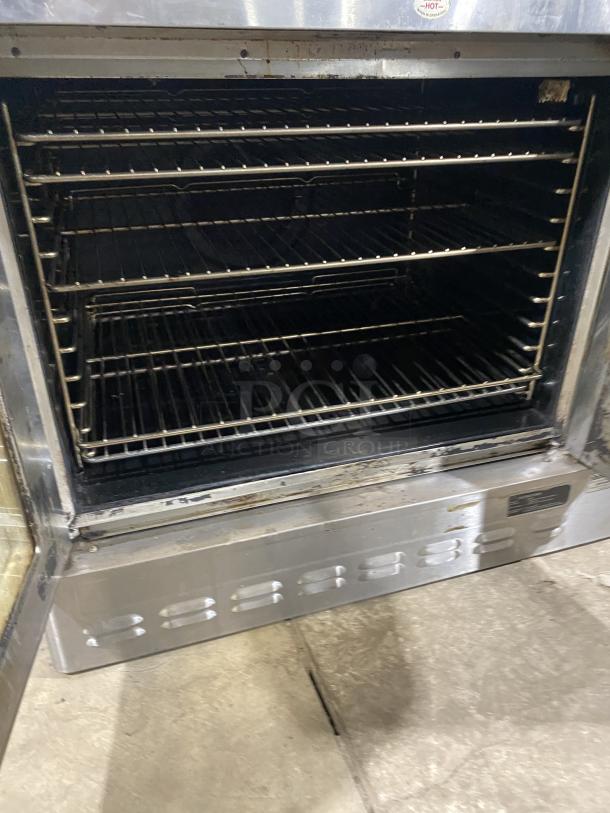 Blodgett commercial stainless steel single stack convection oven with thermostatic control and wired oven racks, pre-owned.