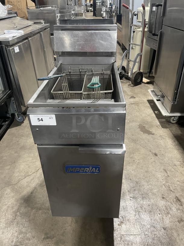 Imperial stainless steel natural gas deep fat fryer with back splash, basket hanger, and legs; features Imperial logo.