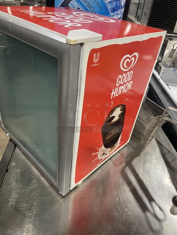 Good Humor Model 8210 countertop freezer, white powder-coated, poly coated wire rack, branded exterior, serial 710009120136.