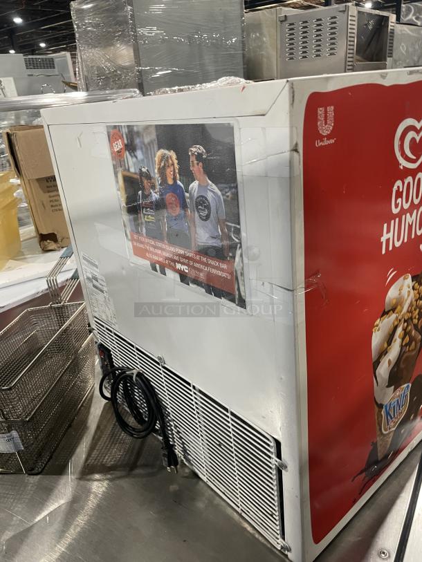 Good Humor Model 8210 countertop freezer, white powder-coated, poly-coated wire rack, slight wear, promotional decals.