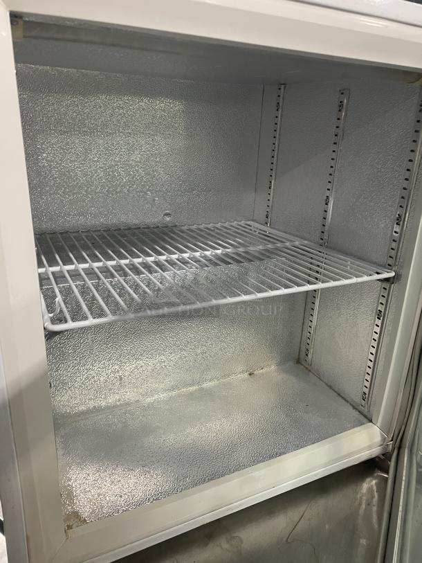 Good Humor Model 8210 white powder-coated countertop freezer with poly-coated wire rack, excellent condition. SN: 710009120136.