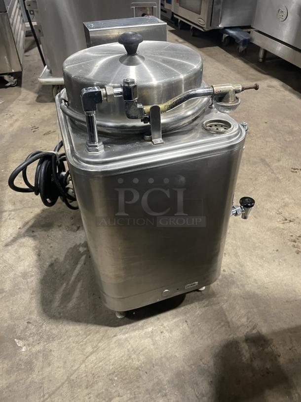 Cecilware FE-75 commercial stainless steel automatic coffee maker, featuring a countertop design and visible connections.