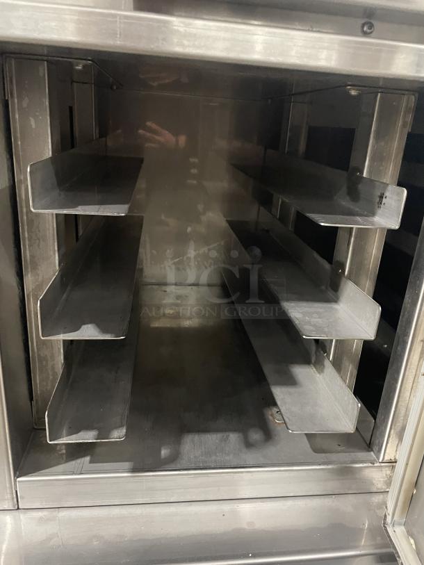 Carter Hoffmann CC345 commercial heating/proofer cabinet, stainless steel, on casters, interior view, model and serial number label.