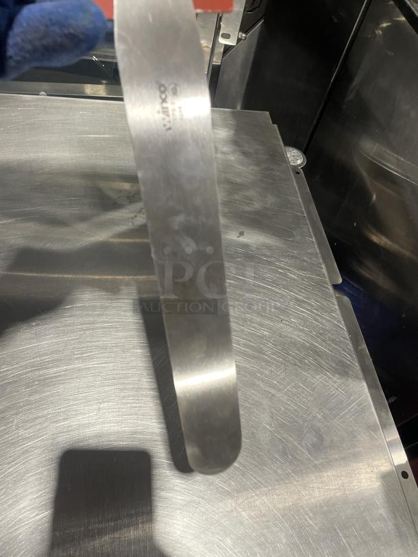 BRAND NEW Winco Winware TKPS-9 bakery spatula, stainless steel with black grip handle. Auction item.