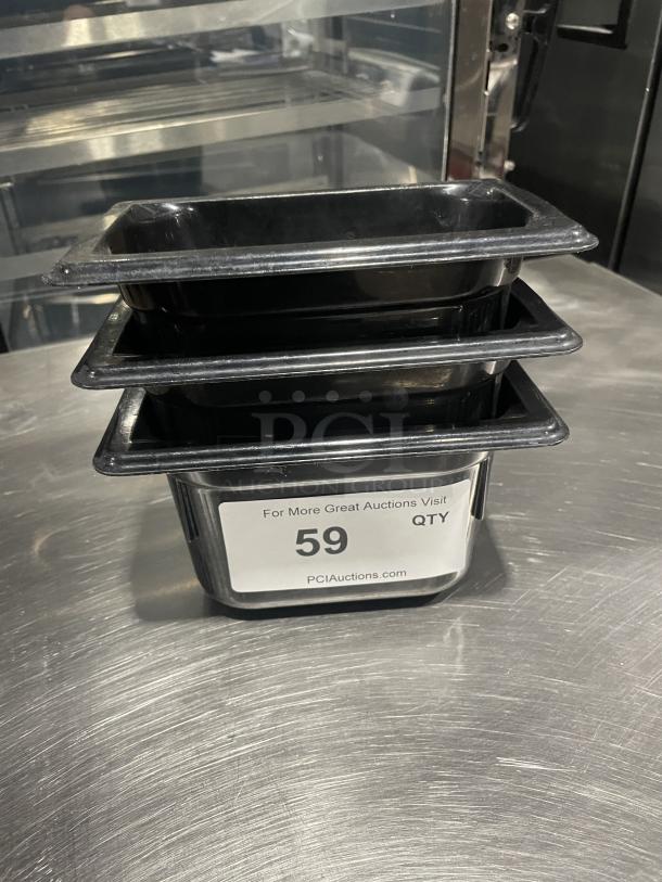 Commercial black plastic food pan set, good condition, stackable. Label reads "59 QTY" from PCIAuctions.com.