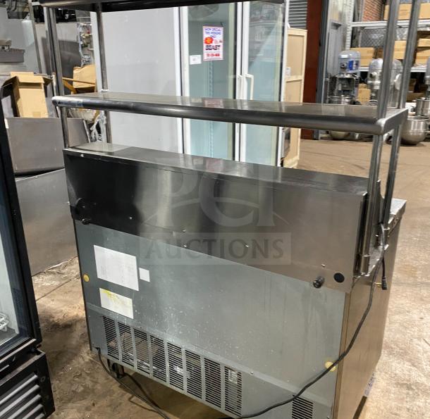 Hoshizaki CRMR48-12 commercial stainless steel refrigerator with top rail, Model SN: B50037E, features visible rear and label tag.