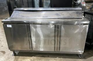 Asber 3-door stainless steel prep table refrigerator, model APTS7218, on casters, with poly coated rack, good condition.