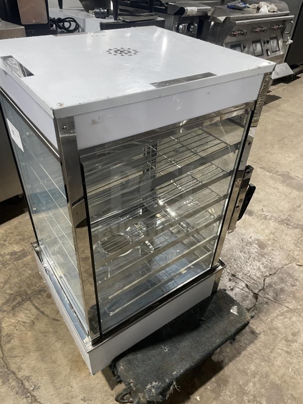 Commercial stainless steel electric bun steamer with 5 layers, glass door, and food display warmer. Excellent condition.