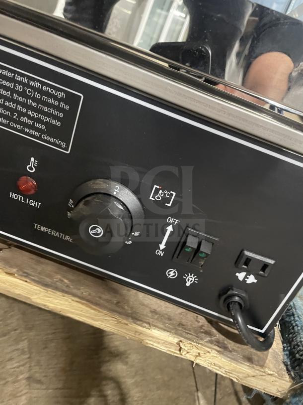 Commercial stainless steel electric bun steamer, 5-layer, with glass door. Features temperature control, switches, and power cord.