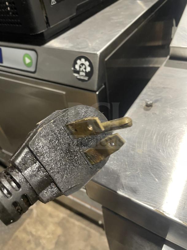 MerryChef Eikon E4 rapid cook oven with EasyTouch touchscreen, stainless steel, 208/240V, two-phase plug visible.