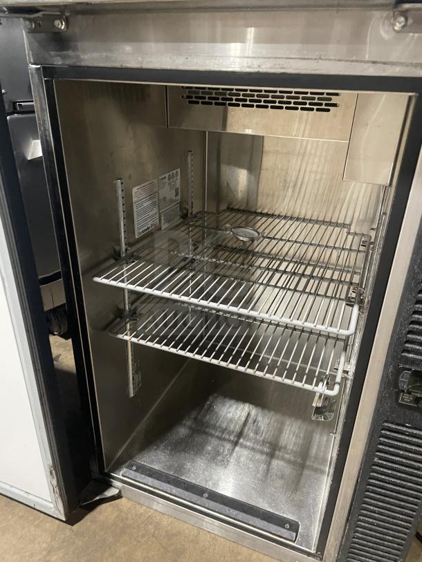 Glastender Model F1SB24 commercial stainless steel black cooler and glass froster, interior view with shelves, SN: 290200666.