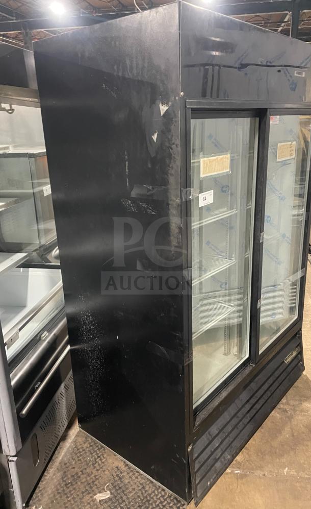 Beverage-Air black double glass door merchandiser, Model MT45. Features poly-coated wire racks. Visible wear.
