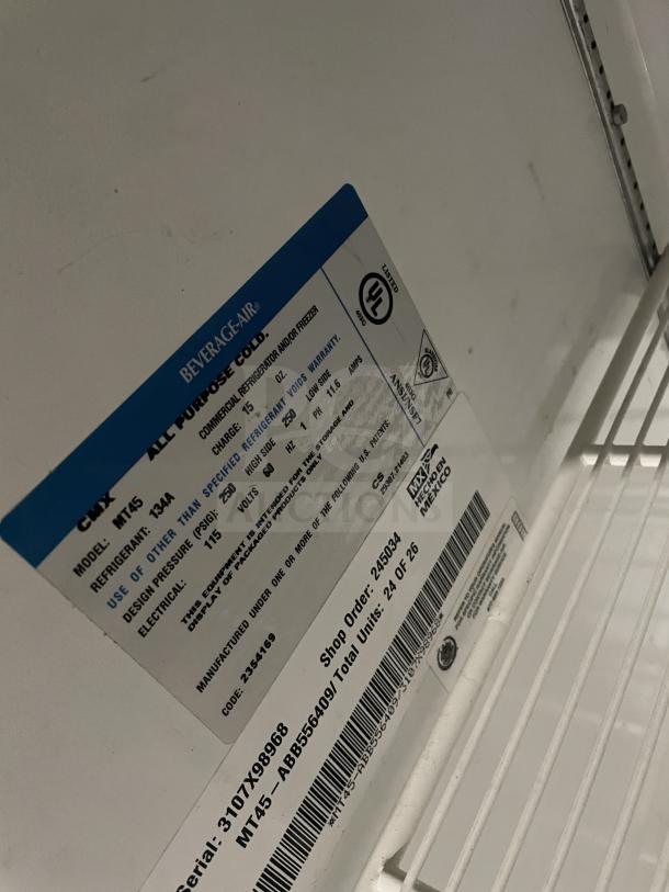 Beverage-Air MT45 commercial refrigerator label showing model, serial number, and specifications. Poly-coated rack visible.