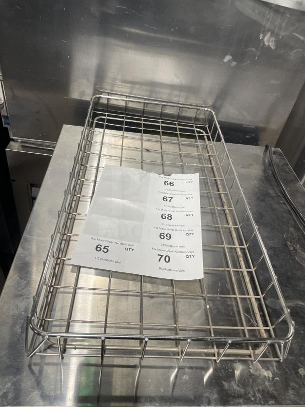 Chrome-plated full-size bagel/pastry wire rack in excellent condition with auction tags indicating item numbers 65-70.