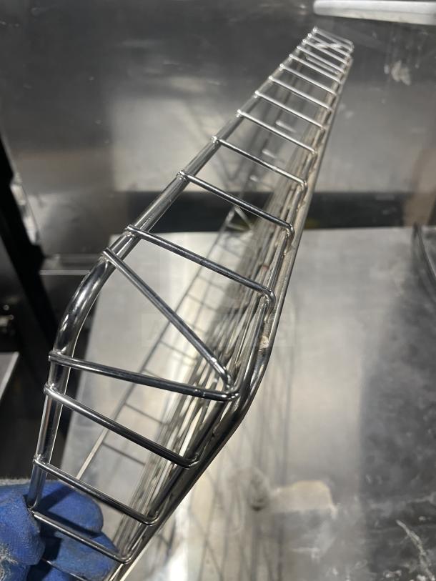 Commercial chrome-plated full-size bagel/pastry wired rack, robust build, excellent condition, ideal for bakery display.