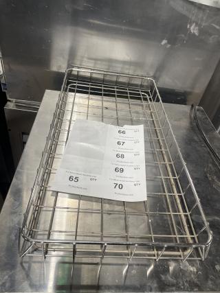 Chrome plated full-size bagel/pastry wire rack, excellent condition, visible auction labels with lot numbers.