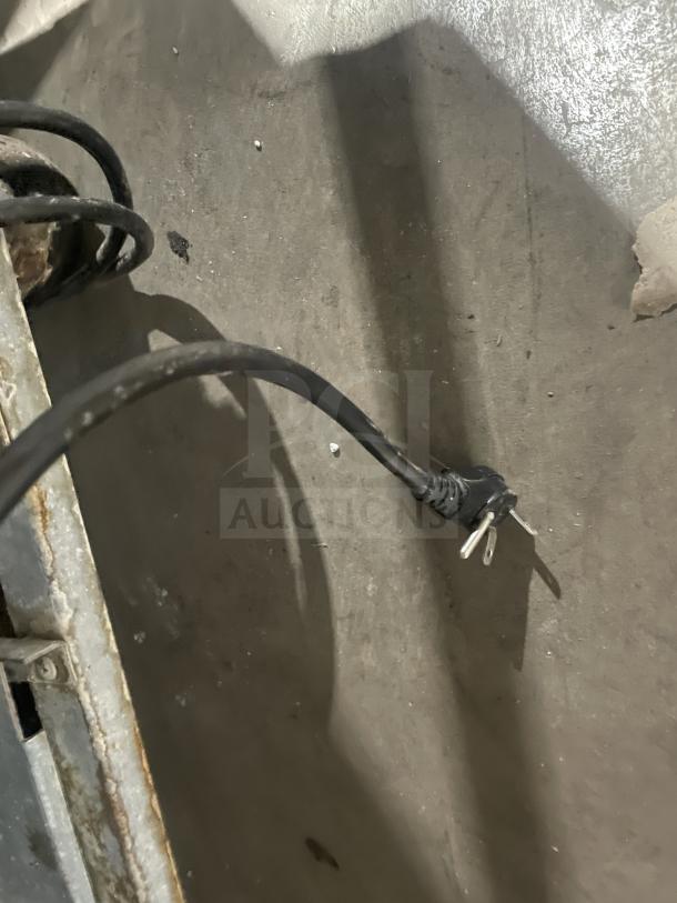 Power cord of the Kelvinator commercial stainless steel two-door reach-in freezer, model KCBM48RSE-HC.