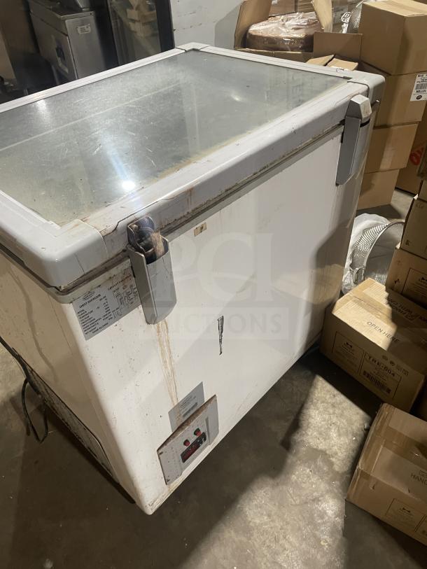 Nordon SDS-250 commercial ice cream dipping cabinet. 115V, 60HZ. Some rust and wear visible. Top glass lid.