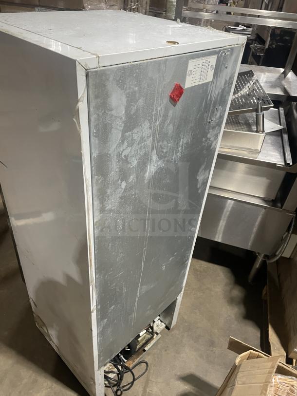 Everest EMGR10 commercial freezer, single glass door, poly coated wire racks, visible wear, model label on side, 115V, 60Hz.