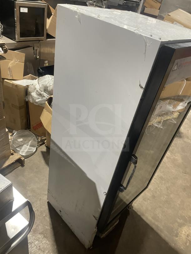 Everest EMGR10 single glass door merchandiser freezer with poly-coated wire racks, showing minor wear.