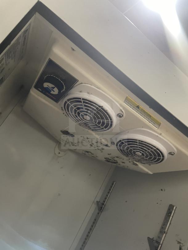 Everest EMGR10 freezer interior with dual fans and caution label visible. Poly coated wire racks not shown. Used condition.