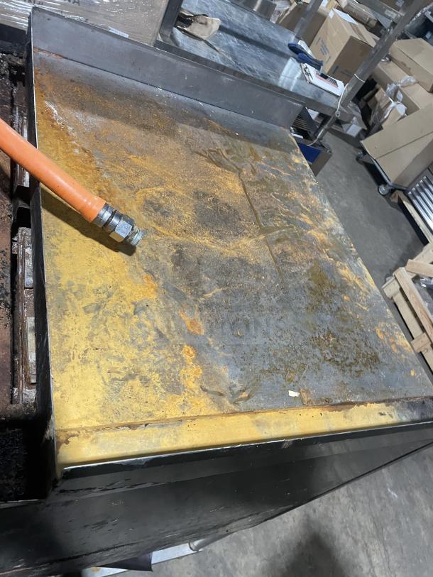 Montague C36SHB stainless steel countertop gas char broiler grill. Visible wear, on legs with equipment stand and storage. Model A8-D-73003A.