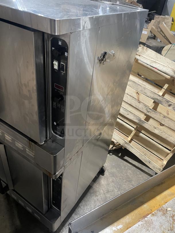 Blodgett double stacked stainless steel gas convection oven, thermostatic controls, wired rack, on casters.