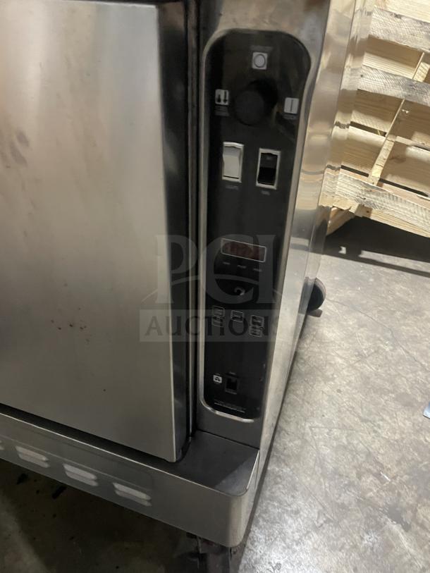 Blodgett stainless steel gas convection oven, double stacked, thermostatic controls, oven rack, on casters, commercial use.