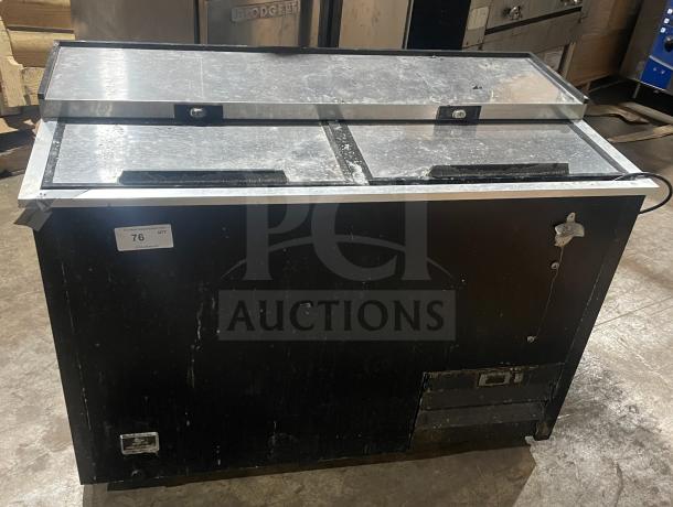 Kelvinator commercial bottle cooler, model AUB50RZ, stainless steel, horizontal, on casters, used condition.