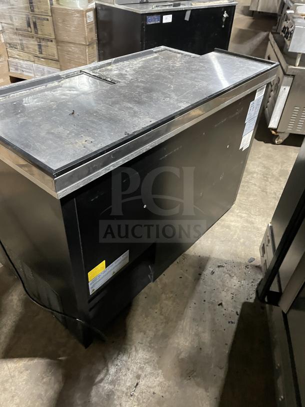 Kelvinator commercial cooler, Model AUB50RZ, stainless steel, top lids, on casters, visible wear, 115V, 60HZ label.