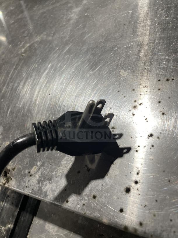 Kelvinator Commercial Bottle Cooler, Model AUB50RZ, stainless steel, with casters, electrical plug detail shown.