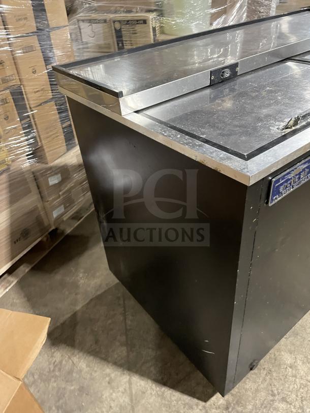Arctic Air AUB50RZ stainless steel deep well bottle cooler, model SN: H20039388. Features stainless steel top, lids, on casters. 115V, 60HZ.