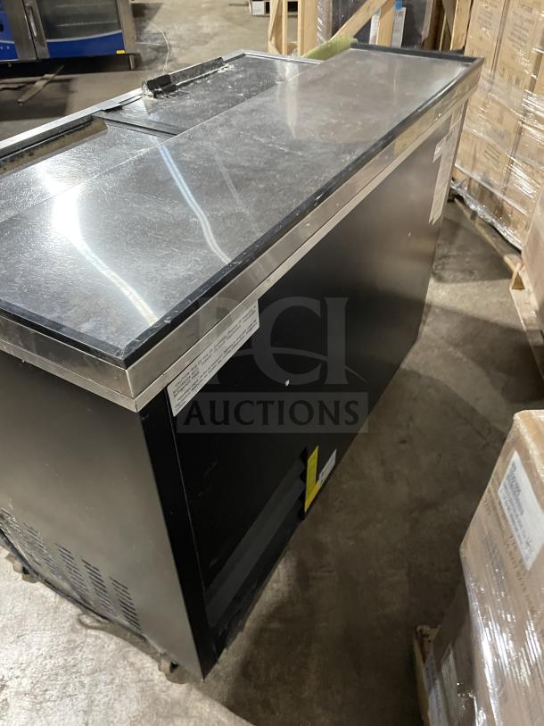 Stainless steel Arctic Air AUB50RZ bottle cooler on casters, commercial top with lids, model SN: H20039388, 115V, 60Hz.