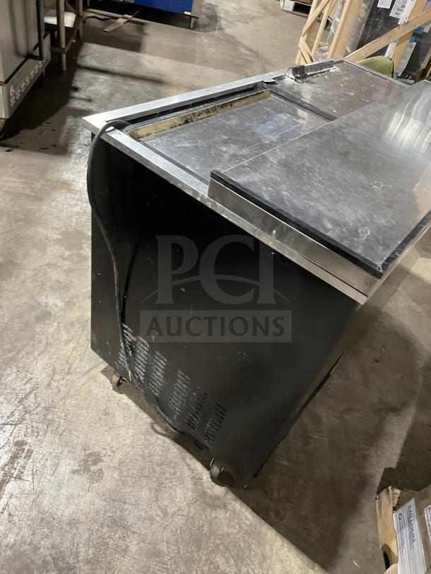 Arctic Air AUB50RZ stainless steel bottle cooler with top lids, on casters. Model: AUB50RZ SN: H20039388. 115V, 60HZ.