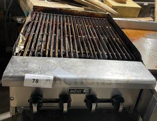 Asber commercial stainless steel gas griddle with side splashes, countertop model on legs. Used condition, visible wear.