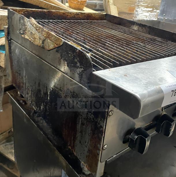 Asber stainless steel countertop gas griddle with side splashes. Used condition, visible wear and stains, mounted on legs.