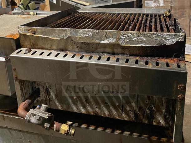 Asber stainless steel countertop gas griddle with side splashes, on legs. Visible wear and rust, commercial use item.