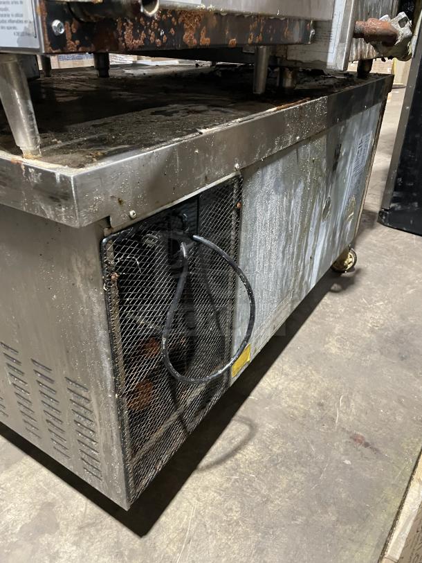 Kelvinator stainless steel refrigerated chef base, model KCHCB48R, with two drawers, 115V, on casters, shows wear.