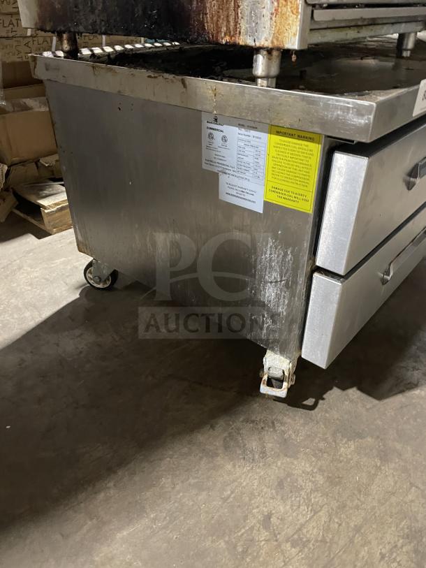 Kelvinator stainless steel chef base with 2 drawers, model KCHCB48R, on casters. Electric, 115V, 60HZ. Visible labels.