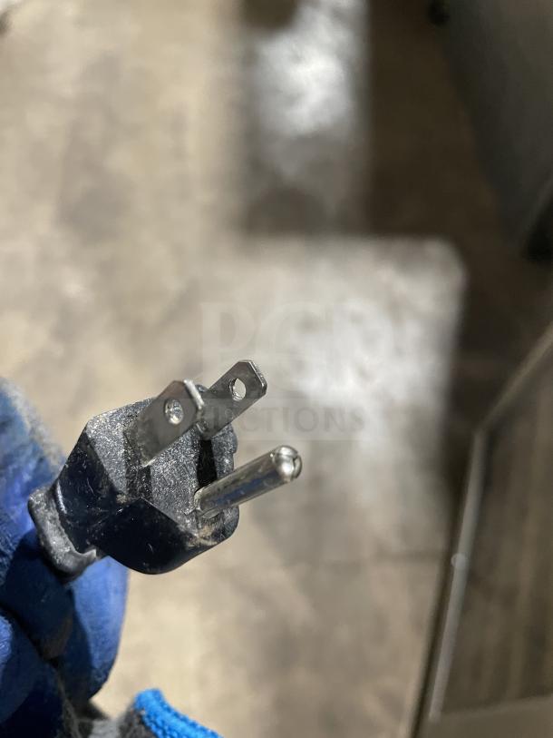 A Eurodip wine cooler plug, model USF-168S. Slightly dusty. 110/120V, 60 Hz. For commercial use.