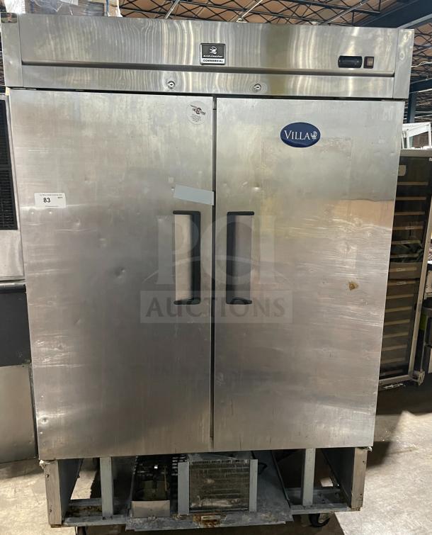 Kelvinator commercial stainless steel 2-door refrigerator with poly-coated wire racks, 115V, 60HZ, on casters, in good condition.