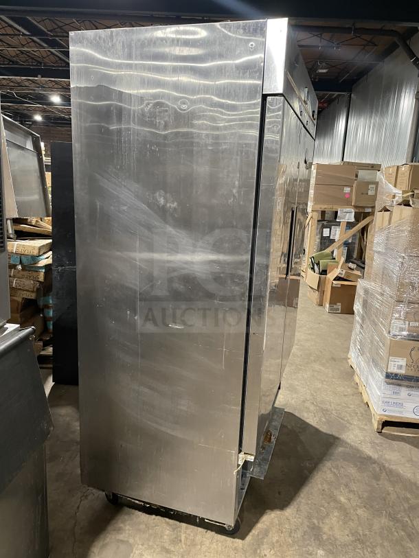 Kelvinator commercial stainless steel 2-door reach-in refrigerator, poly-coated wire racks, 115V, on casters, in decent condition.