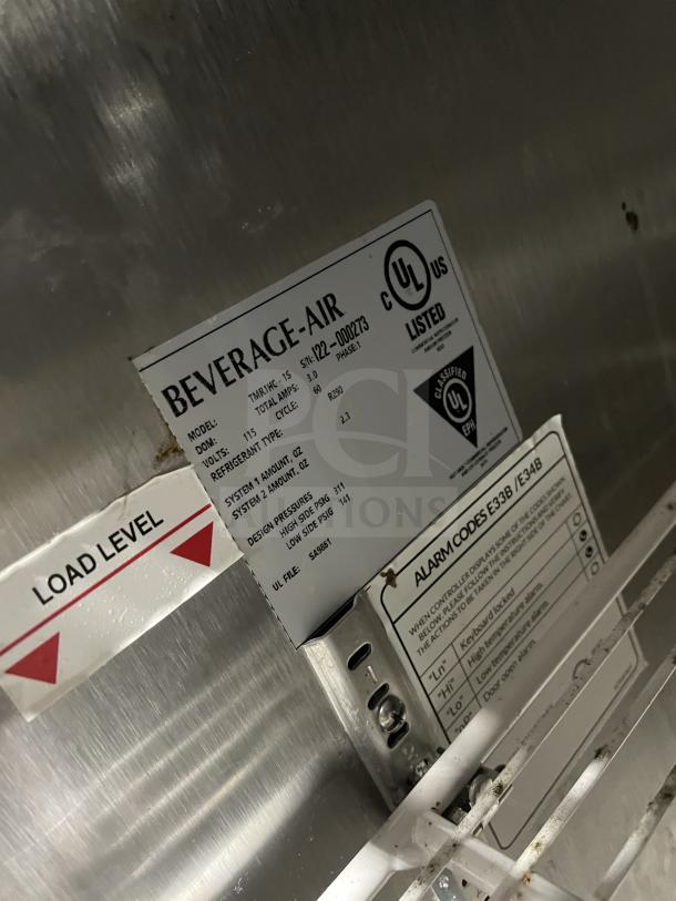 Beverage Air stainless steel undercounter fridge, model TMR1HC-1S, on casters, with poly rack and visible UL certification label.