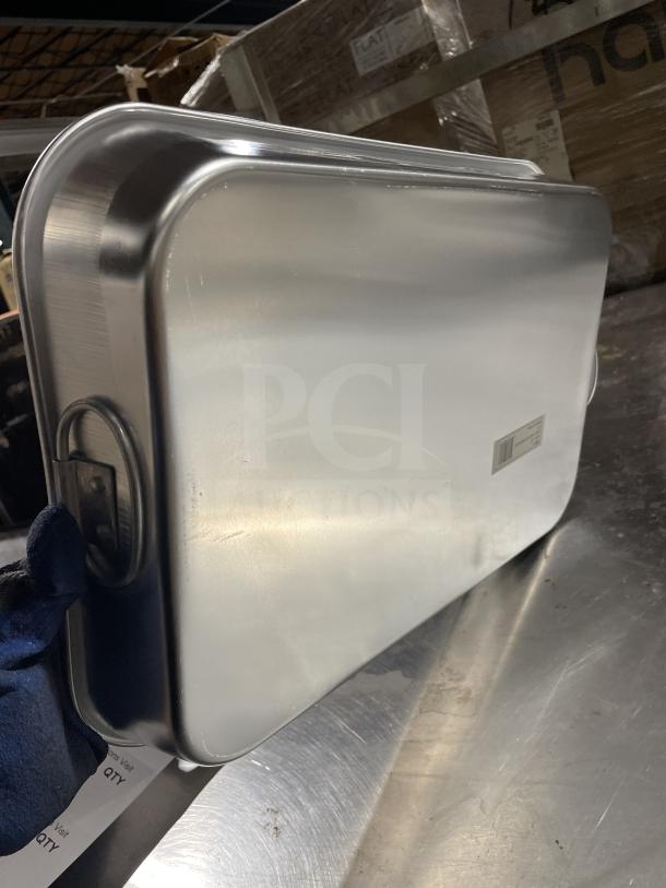 Winco commercial stainless steel bake pan, excellent condition, with durable handles and sleek design.