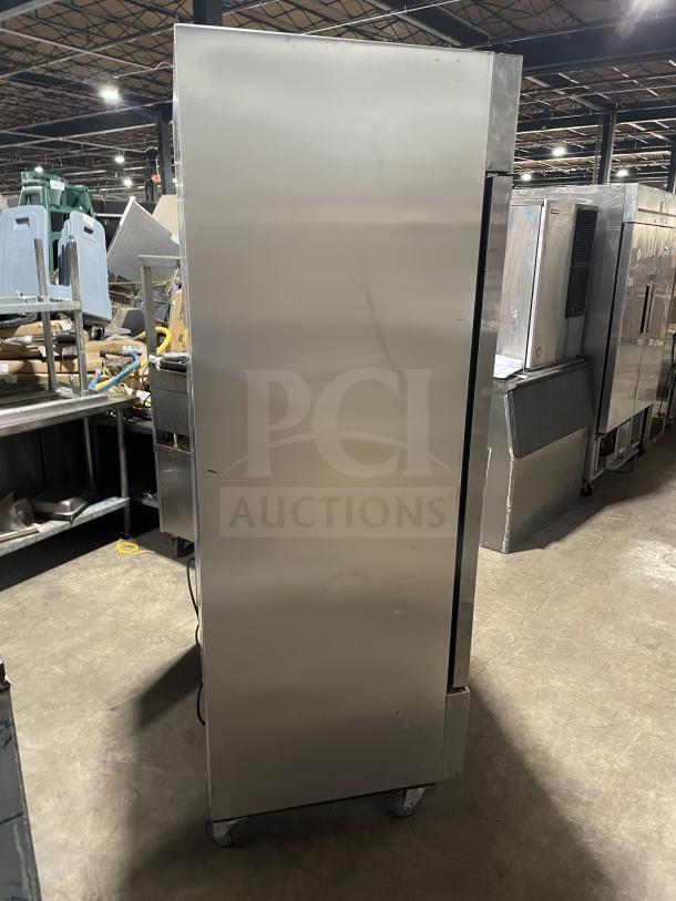 True T-43-HC commercial stainless steel 2-door reach-in refrigerator on casters. Features poly coated wired rack.