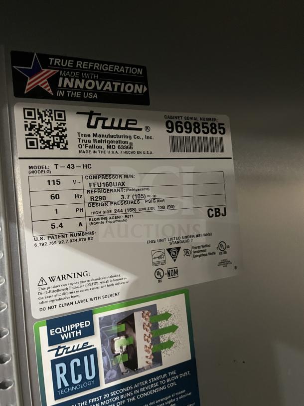 True T-43-HC stainless steel 2-door reach-in refrigerator, poly-coated wire rack, serial 9698585, on casters, 115V 1-phase.