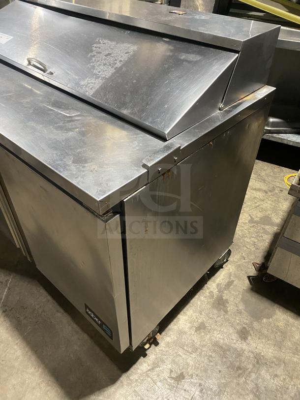 Asber stainless steel 2-door refrigerated bain marie style prep table on casters; commercial use, minor wear.