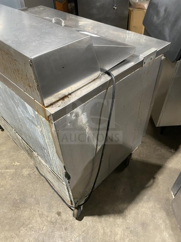 Asber stainless steel 2-door refrigerated bain marie prep table on casters, used condition, visible wear.