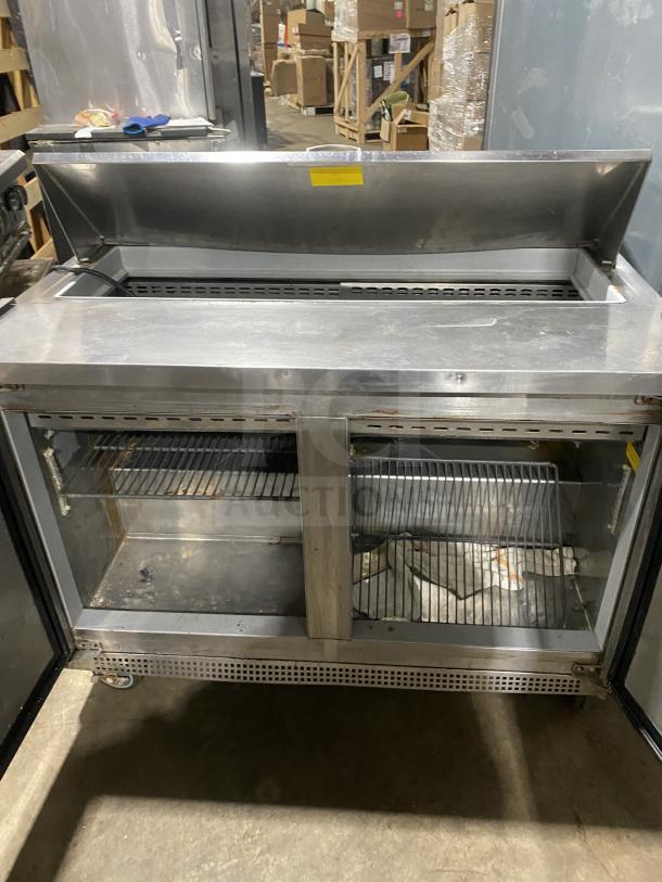 Asber commercial stainless steel 2-door refrigerated salad prep table with bain marie style, on casters, open doors.