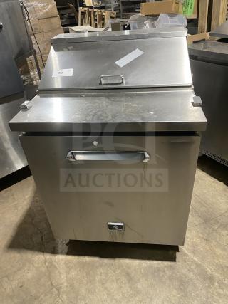 Kelvinator stainless steel refrigerated prep table, model KCHST278, with wired rack, single door, on casters.